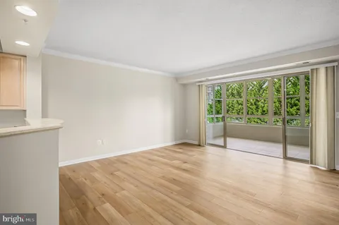 a view of a livingroom with furniture and a window