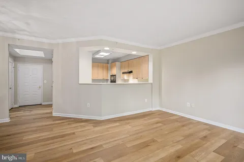 a living room with lots of furniture and a book shelf