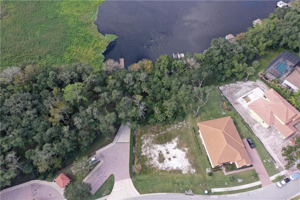 122 Rosa Bella View DeBary, FL 32713 - Photo 3 of 10 an aerial view of a house with a yard and lake view