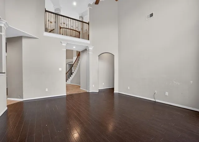 a view of an entryway with wooden floor