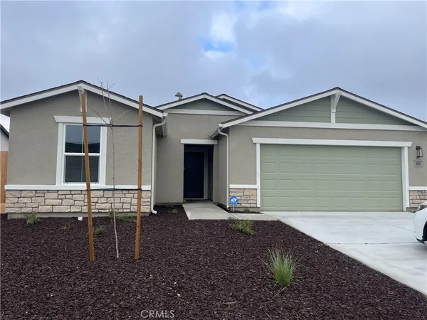 a front view of a house with yard
