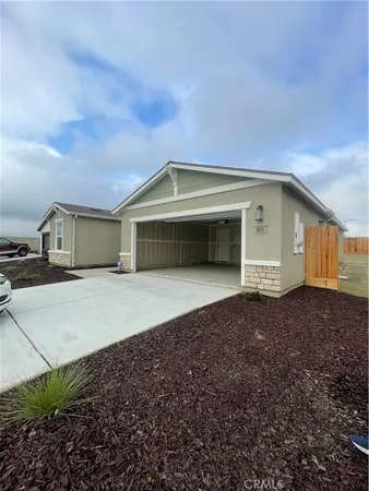 a front view of a house with a garage