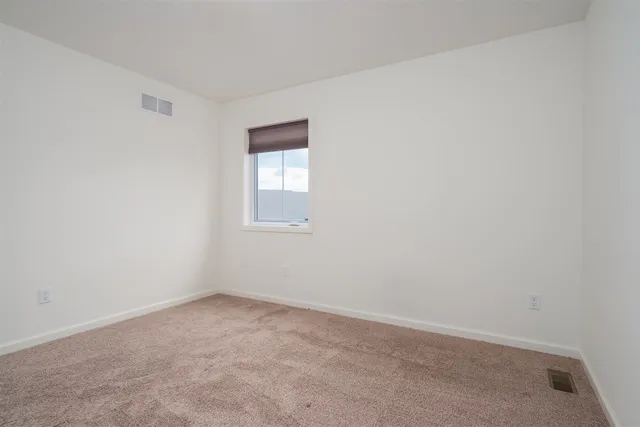 a view of empty room with an entryway