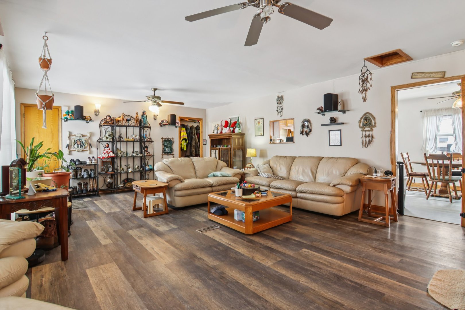 327 Hickory Avenue Romeoville, IL 60446 - Photo 12 of 33 a living room with furniture and a flat screen tv
