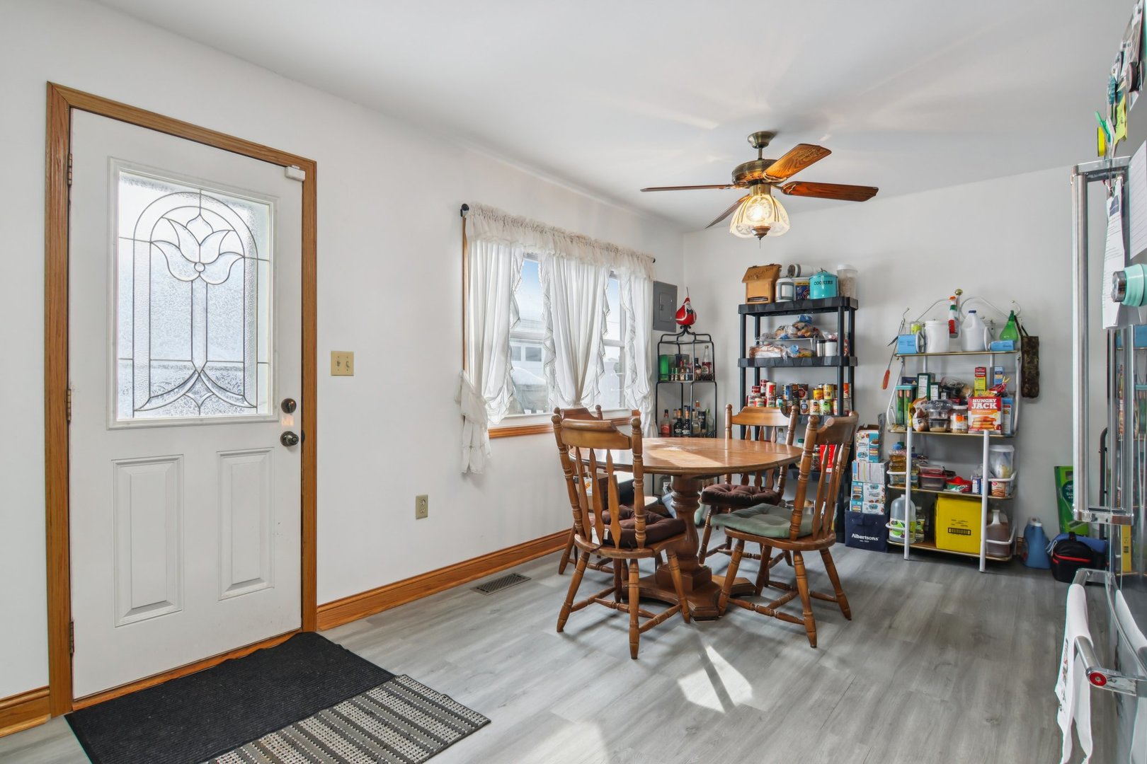 327 Hickory Avenue Romeoville, IL 60446 - Photo 15 of 33 a view of a dining room with furniture and wooden floor