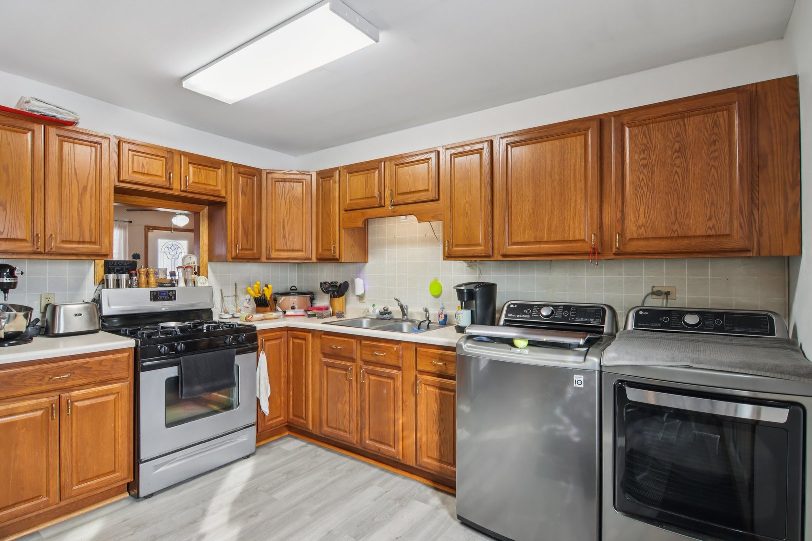 327 Hickory Avenue Romeoville, IL 60446 - Photo 16 of 33 a kitchen with stainless steel appliances granite countertop a stove a sink dishwasher and a refrigerator