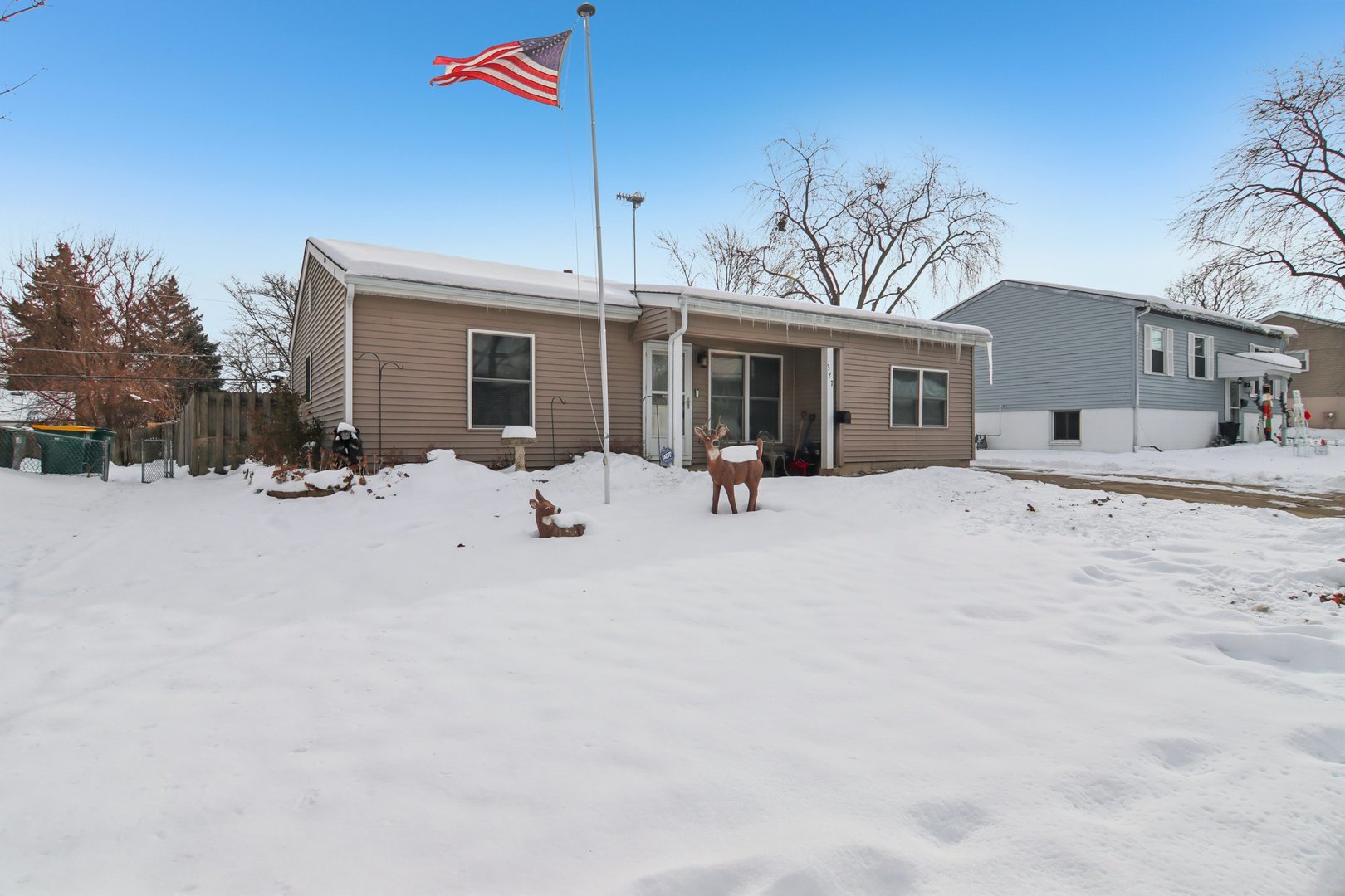 327 Hickory Avenue Romeoville, IL 60446 - Photo 2 of 33 a view of a house with a snow in the yard