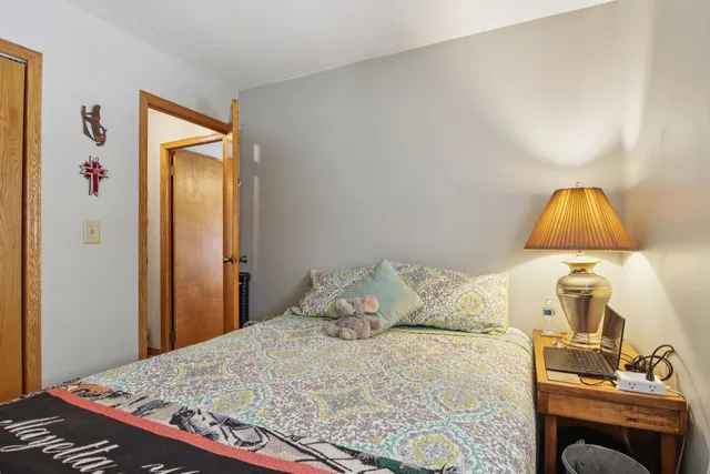 a bedroom with a bed and a dresser