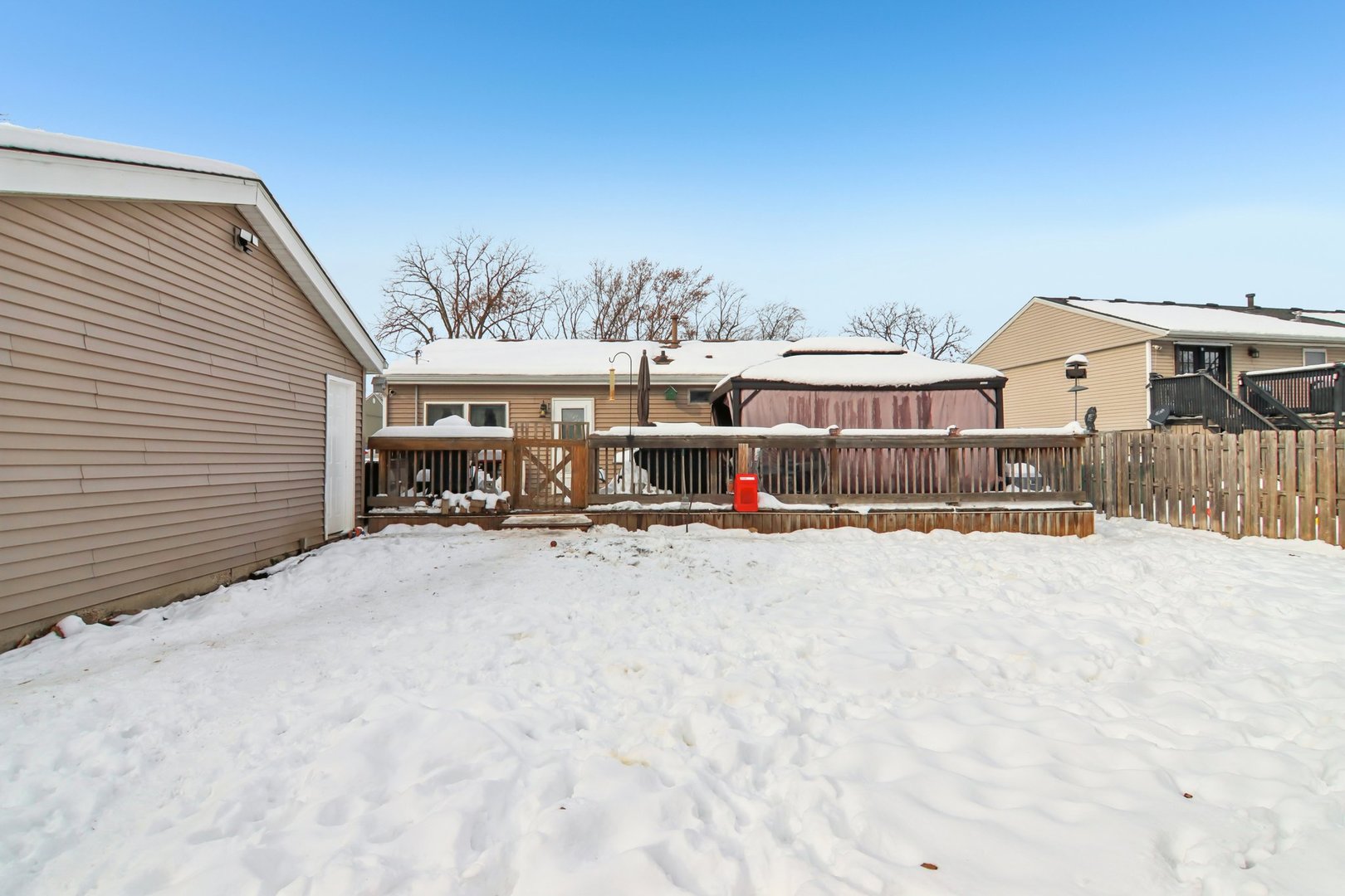 327 Hickory Avenue Romeoville, IL 60446 - Photo 30 of 33 a view of a house with wooden fence