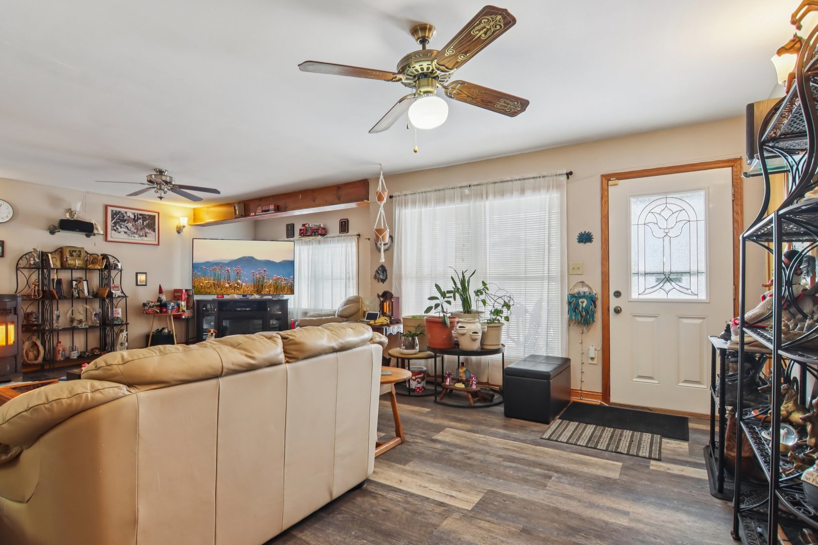 327 Hickory Avenue Romeoville, IL 60446 - Photo 6 of 33 a living room with furniture a fireplace and a window