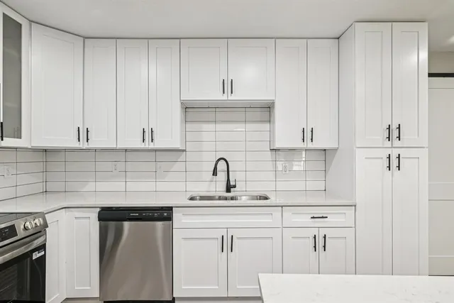 a view of a kitchen counter space and wooden floor