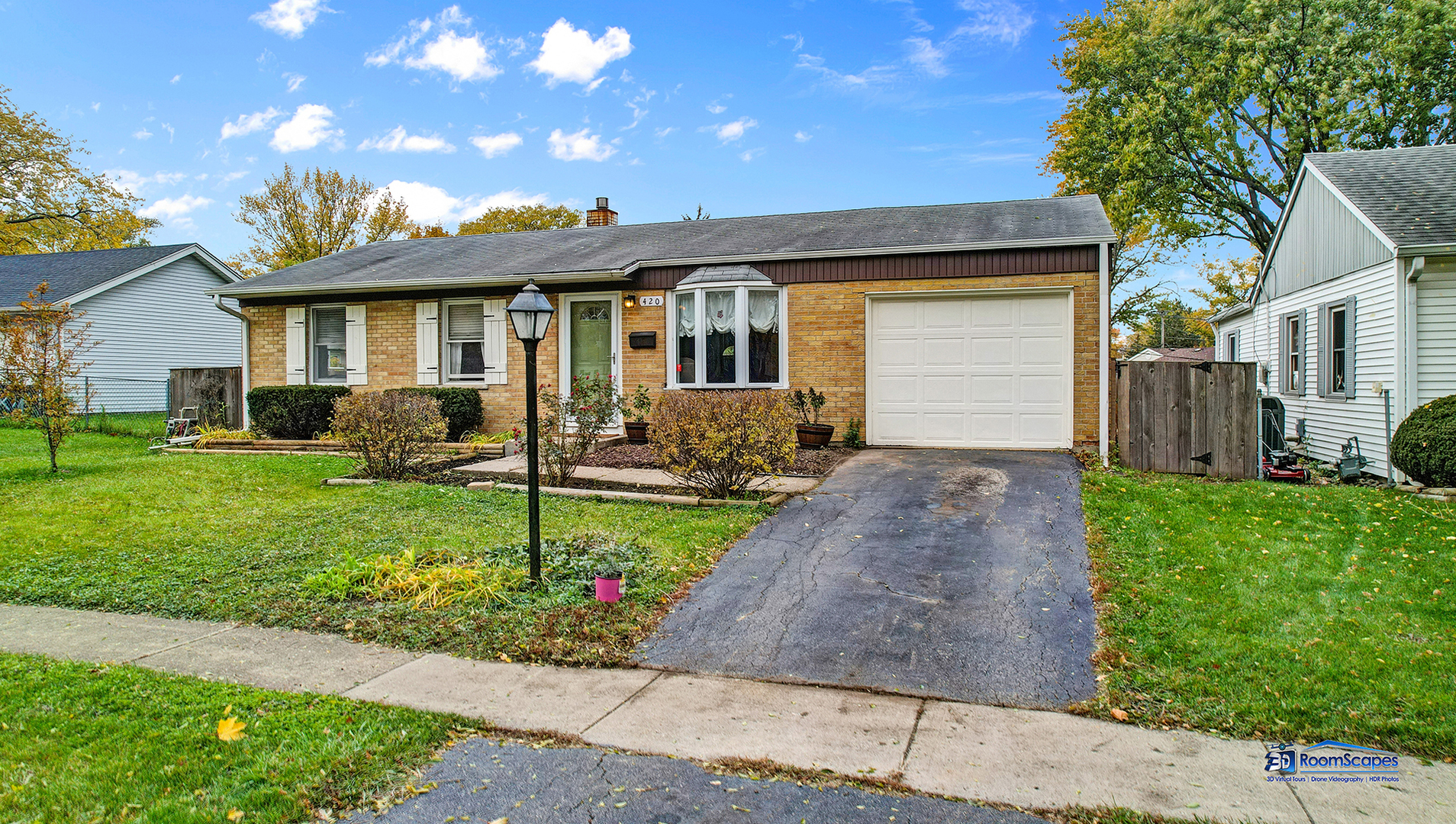 420 Raupp Boulevard Buffalo Grove, IL 60089 - Photo 1 of 41 a front view of a house with a garden and plants