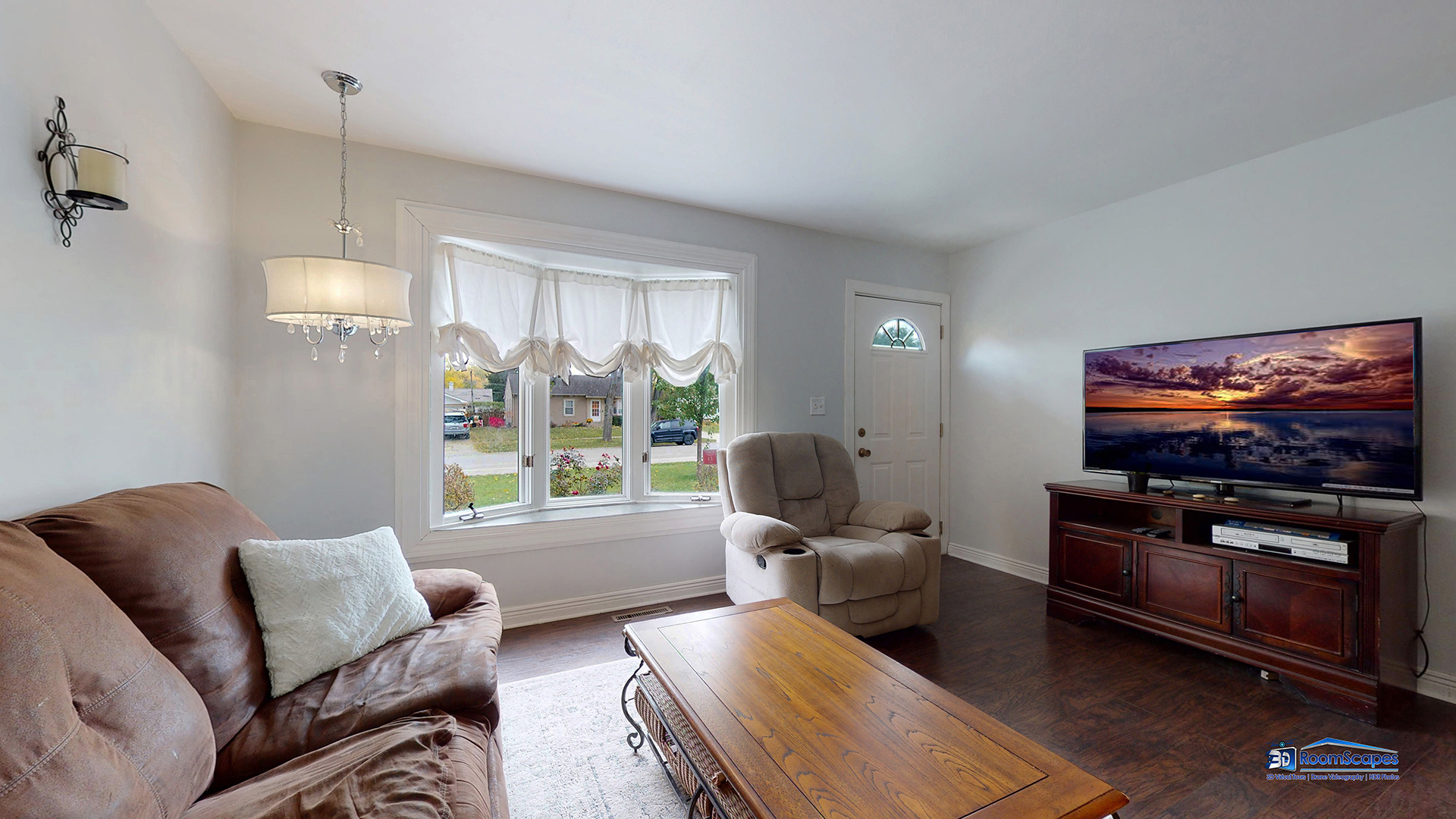 420 Raupp Boulevard Buffalo Grove, IL 60089 - Photo 6 of 41 a living room with furniture a flat screen tv and a window