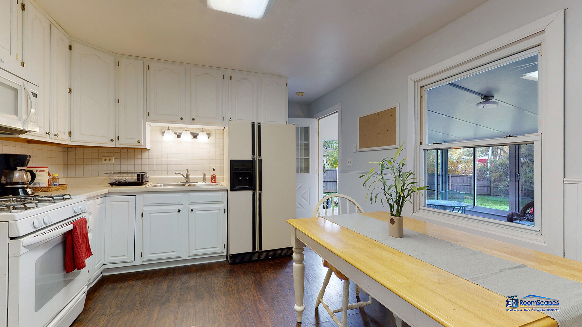 420 Raupp Boulevard Buffalo Grove, IL 60089 - Photo 7 of 41 a kitchen with cabinets and wooden floor