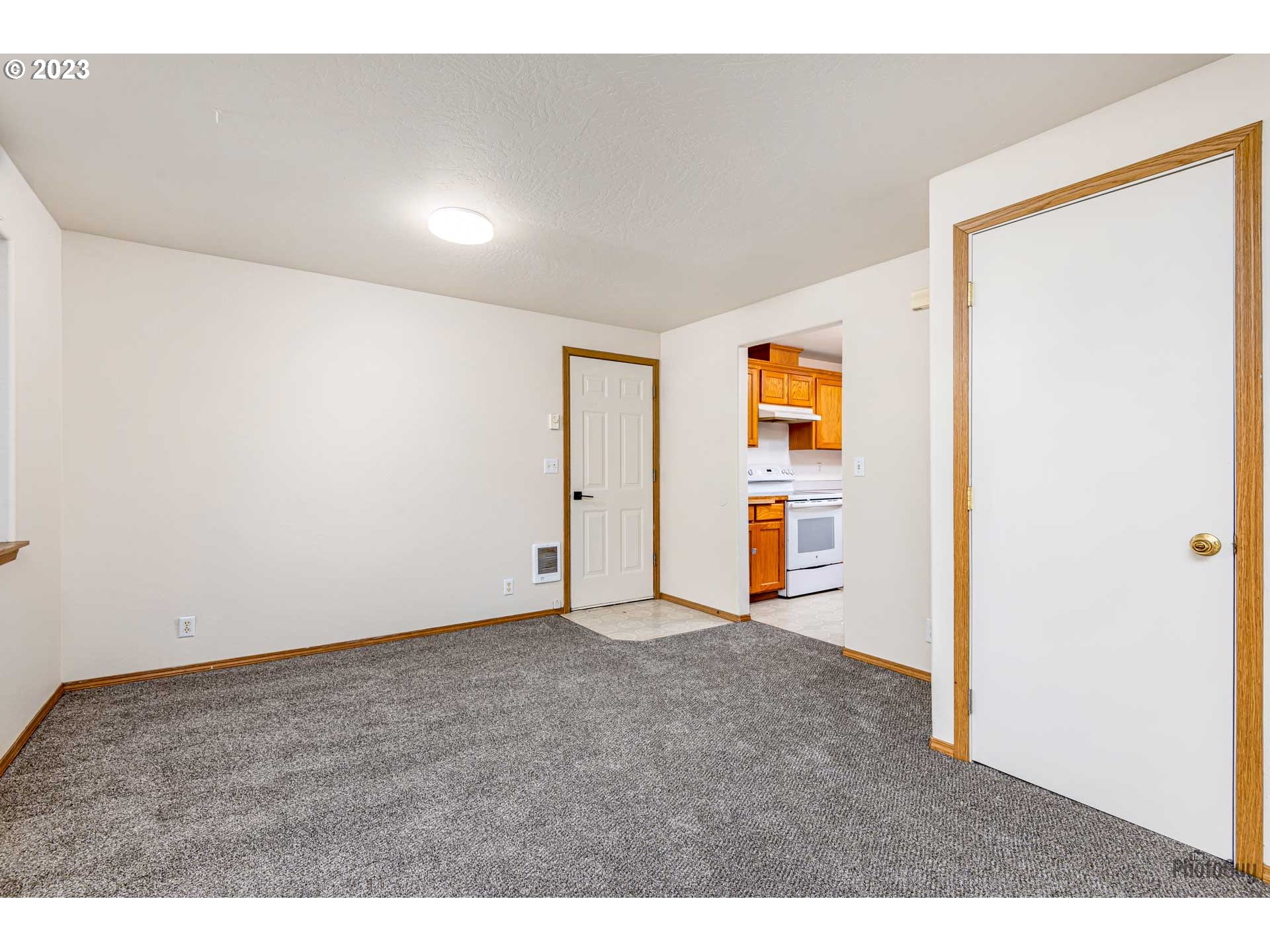 499 South 41st Street Springfield, OR 97478 - Photo 11 of 26 a view of an empty room with wooden floor
