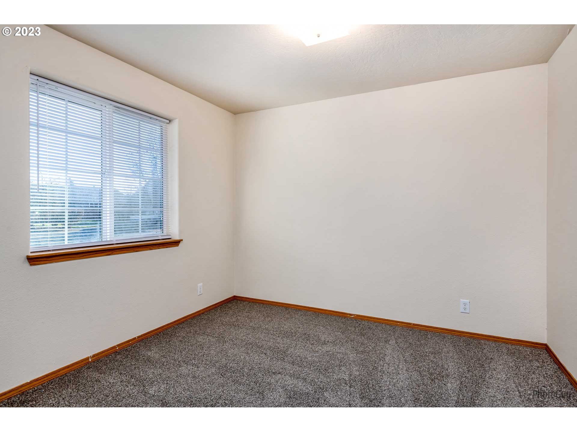 499 South 41st Street Springfield, OR 97478 - Photo 22 of 26 a view of an empty room with a window