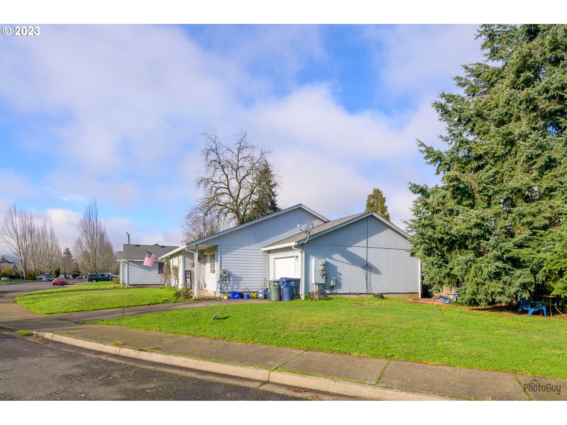 499 South 41st Street Springfield, OR 97478 - Photo 26 of 26 a view of a house with a big yard and large trees