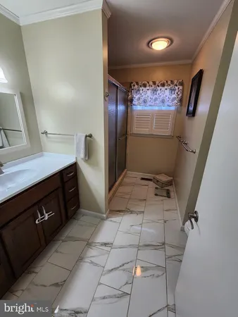 a view of a refrigerator in kitchen and utility room