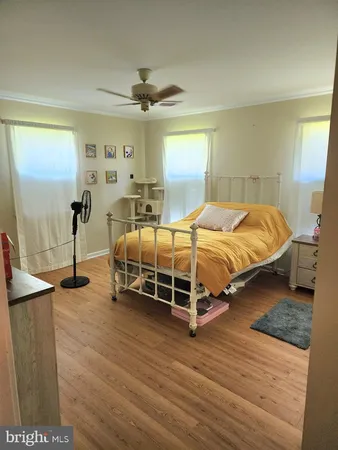 a bedroom with bed and window