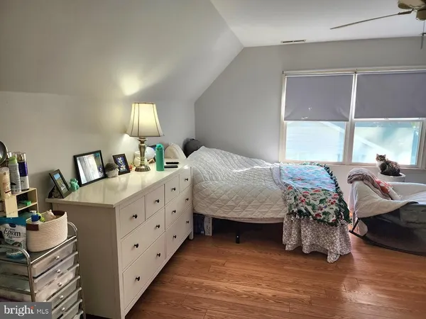 a bedroom with a bed and a dresser