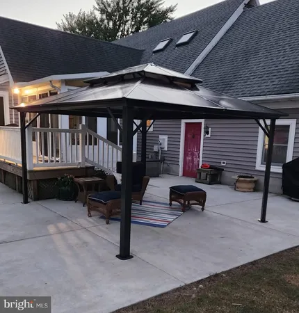 a view of porch with a bench