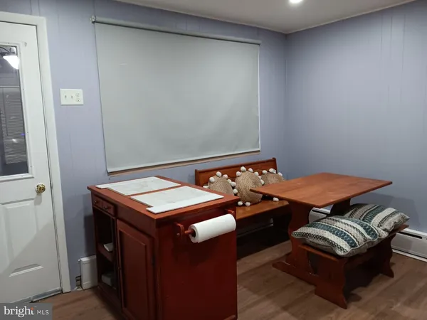 a room with furniture and wooden floor