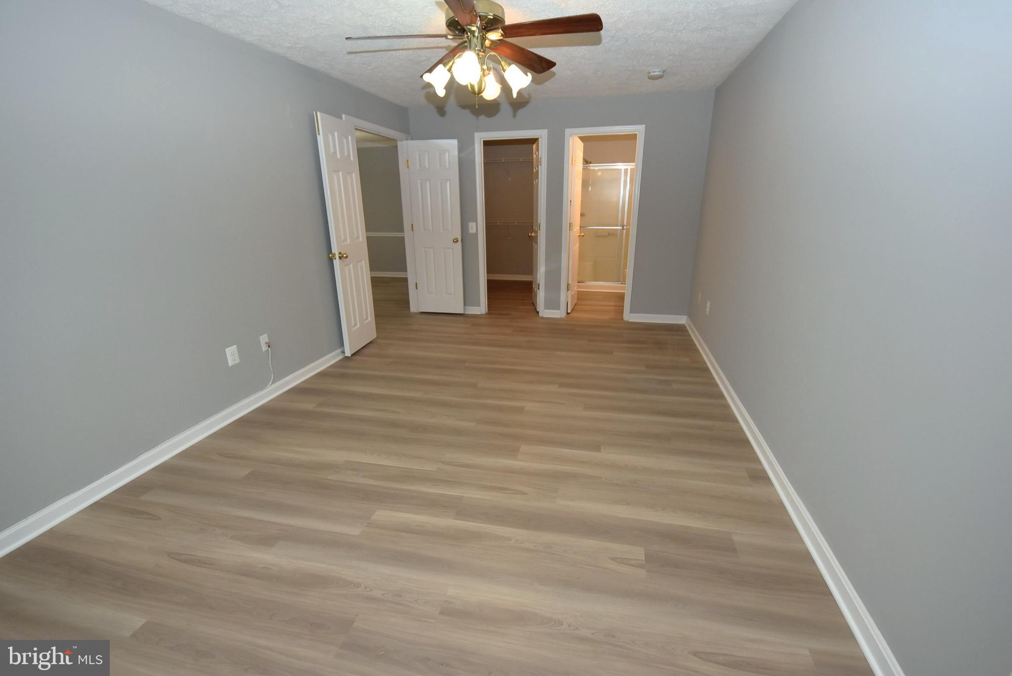 2002 Phillips Terrace, Unit 6 Annapolis, MD 21401 - Photo 12 of 17 wooden floor in an empty room with a window