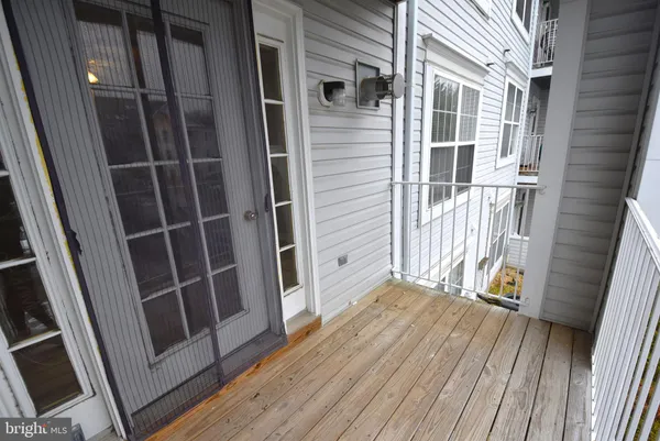 a view of front door deck and floor