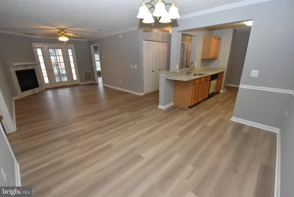 a view of a kitchen with granite countertop a stove top oven