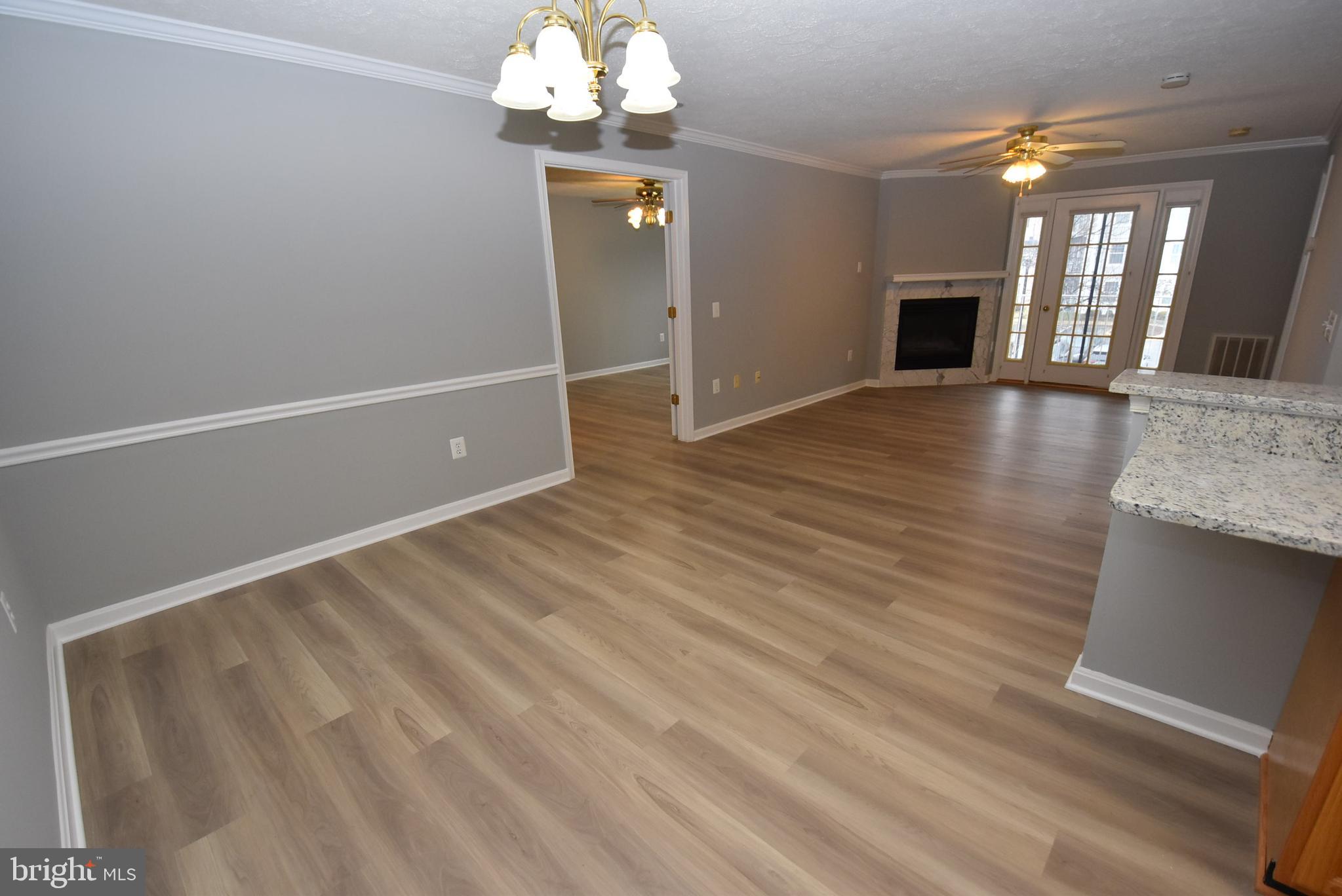 2002 Phillips Terrace, Unit 6 Annapolis, MD 21401 - Photo 3 of 17 wooden floor in an empty room with a window