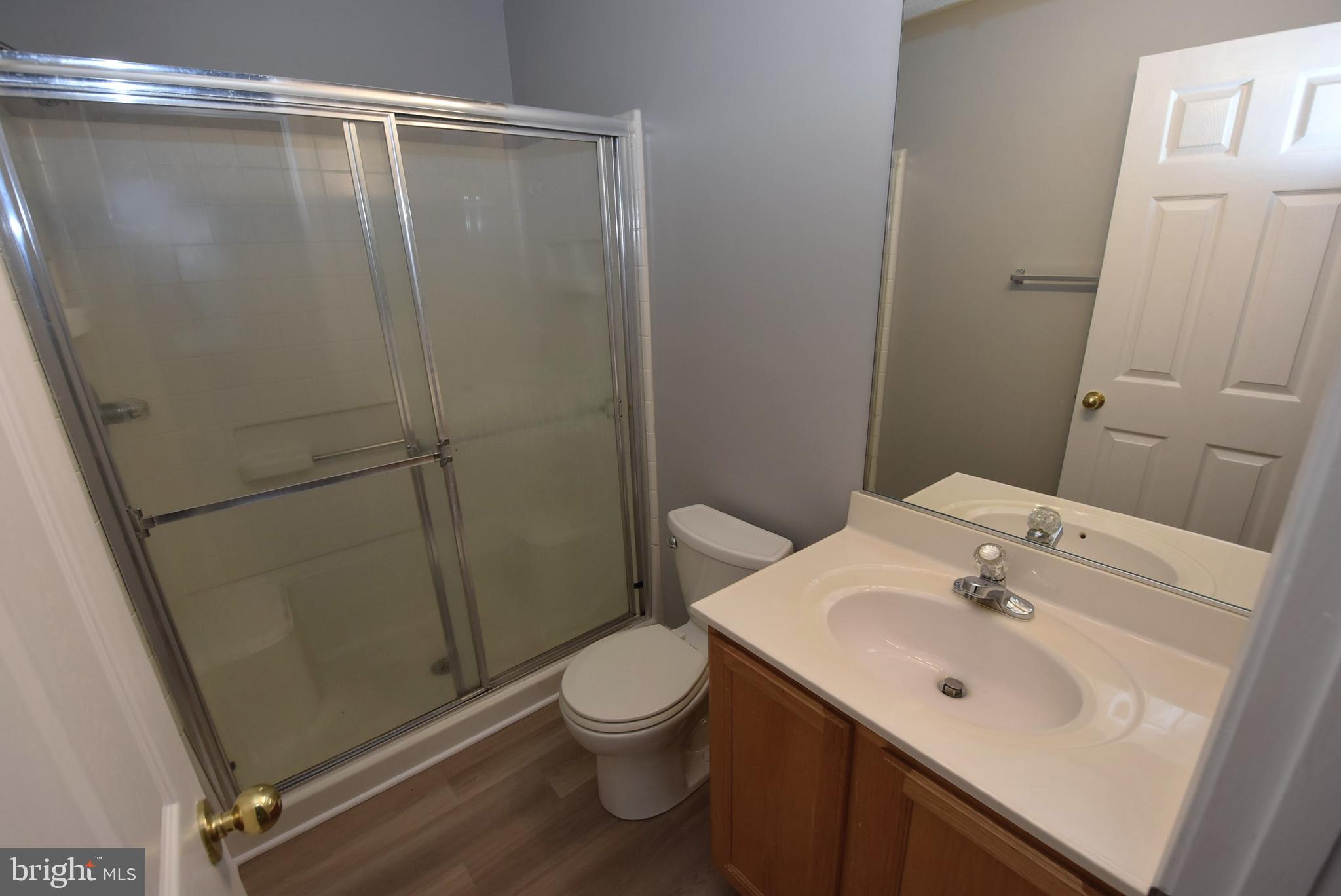 2002 Phillips Terrace, Unit 6 Annapolis, MD 21401 - Photo 10 of 17 a bathroom with a sink a toilet and shower