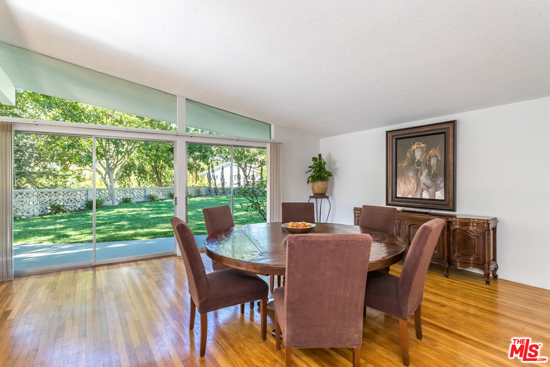 9767 Beth Place Beverly Hills, CA 90210 - Photo 12 of 33 a view of a dining room with furniture window and wooden floor