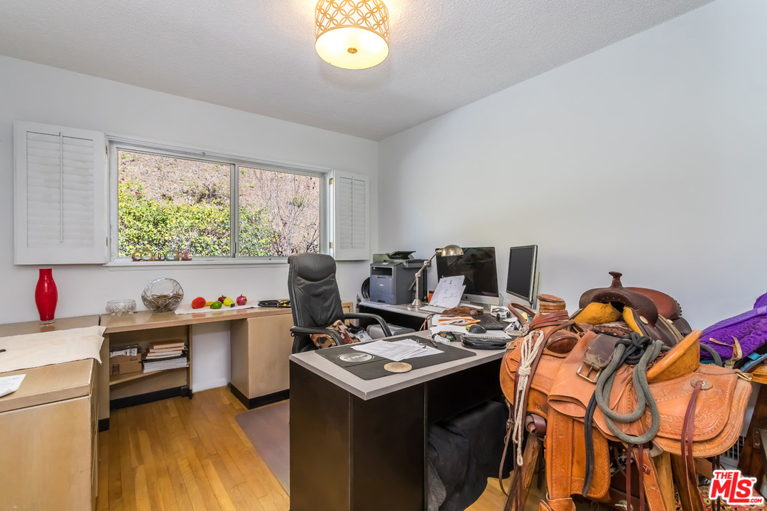 9767 Beth Place Beverly Hills, CA 90210 - Photo 29 of 33 a view of a workspace with furniture and a wooden floor