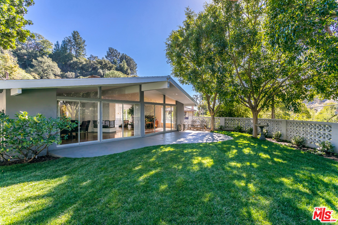 9767 Beth Place Beverly Hills, CA 90210 - Photo 7 of 33 a view of a house with a yard and sitting area