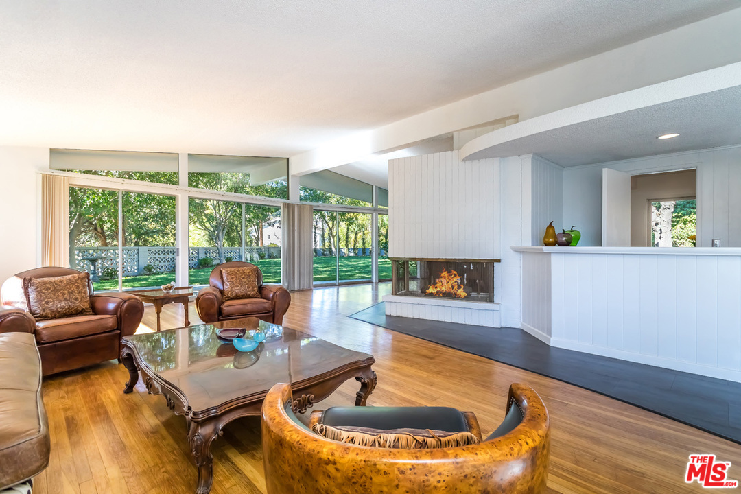 9767 Beth Place Beverly Hills, CA 90210 - Photo 9 of 33 a living room with furniture and a wooden floor