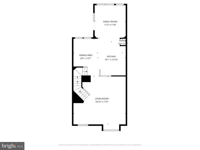 a front view of a house with a tree