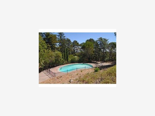 1231 Southdown Road Hillsborough, CA 94010 - Photo 9 of 9 a picture of a bench in a garden