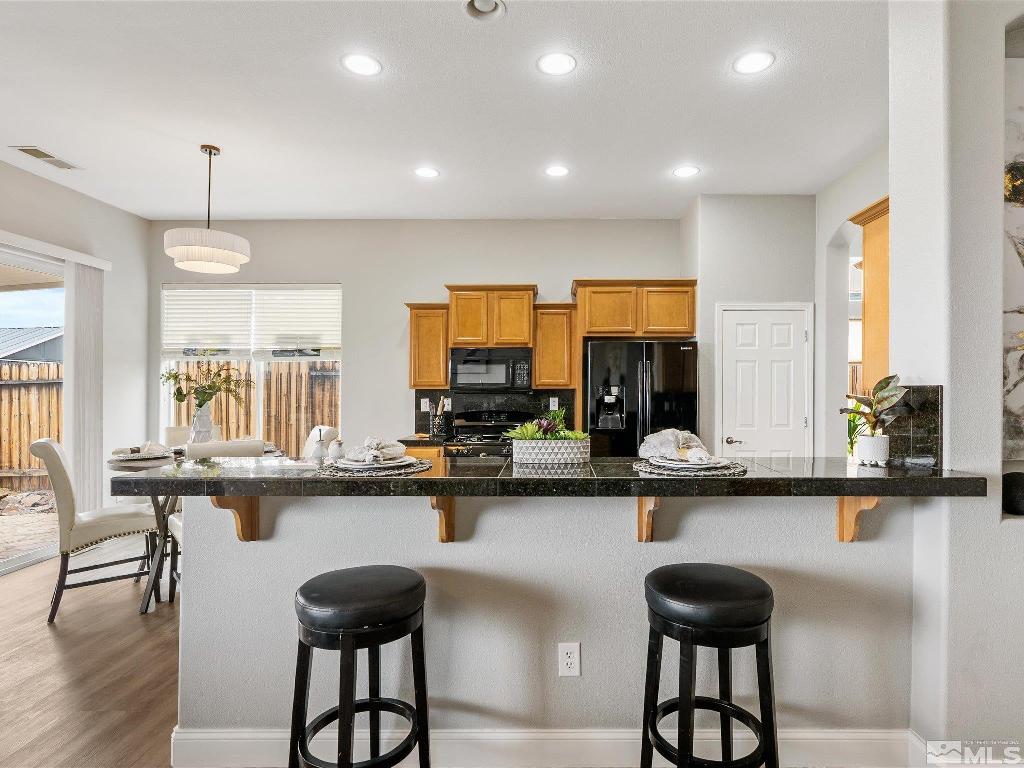 1448 Hagar Road Reno, NV 89506 - Photo 13 of 38 a kitchen with a table and chairs in it