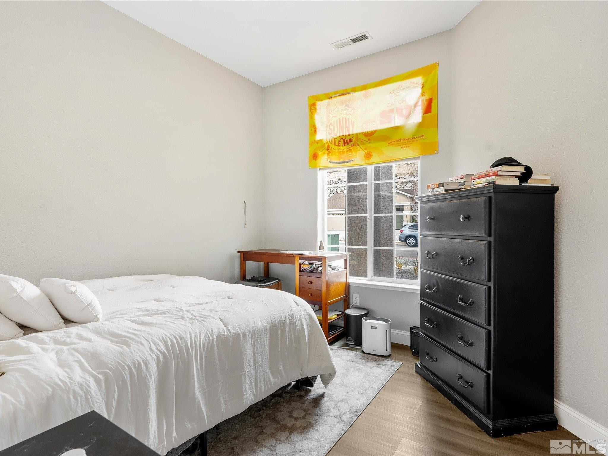1448 Hagar Road Reno, NV 89506 - Photo 17 of 38 a bedroom with a bed and a tv