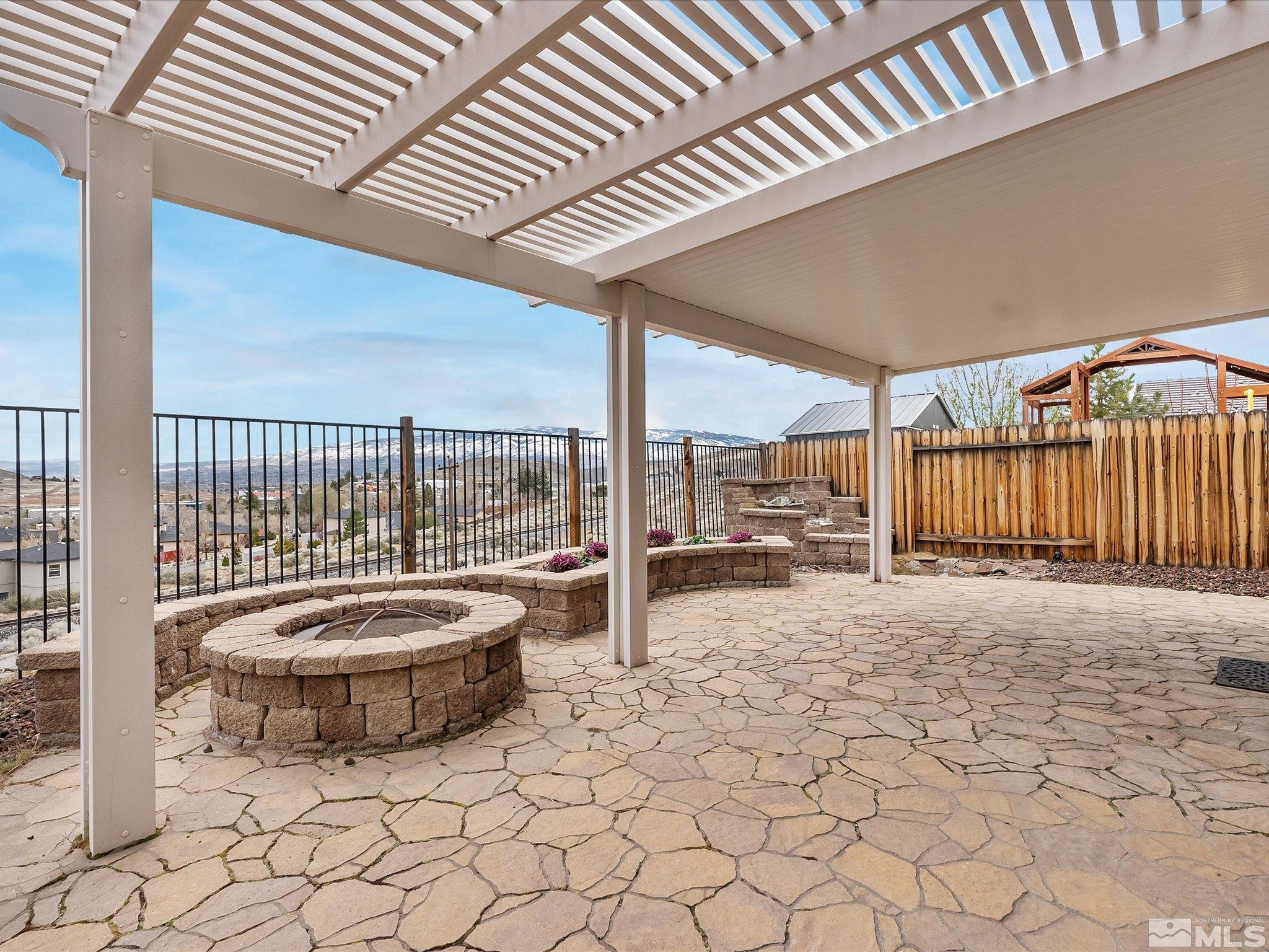 1448 Hagar Road Reno, NV 89506 - Photo 30 of 38 a view of a balcony with chair and iron fence