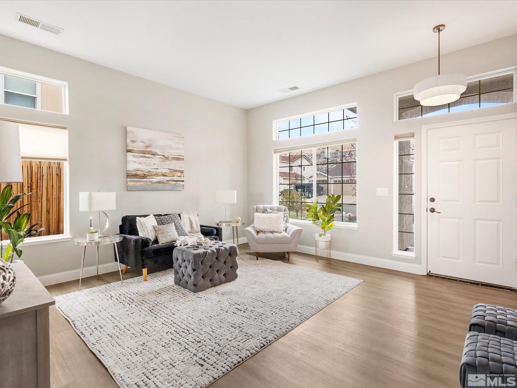 1448 Hagar Road Reno, NV 89506 - Photo 3 of 38 a living room with furniture windows and wooden floor