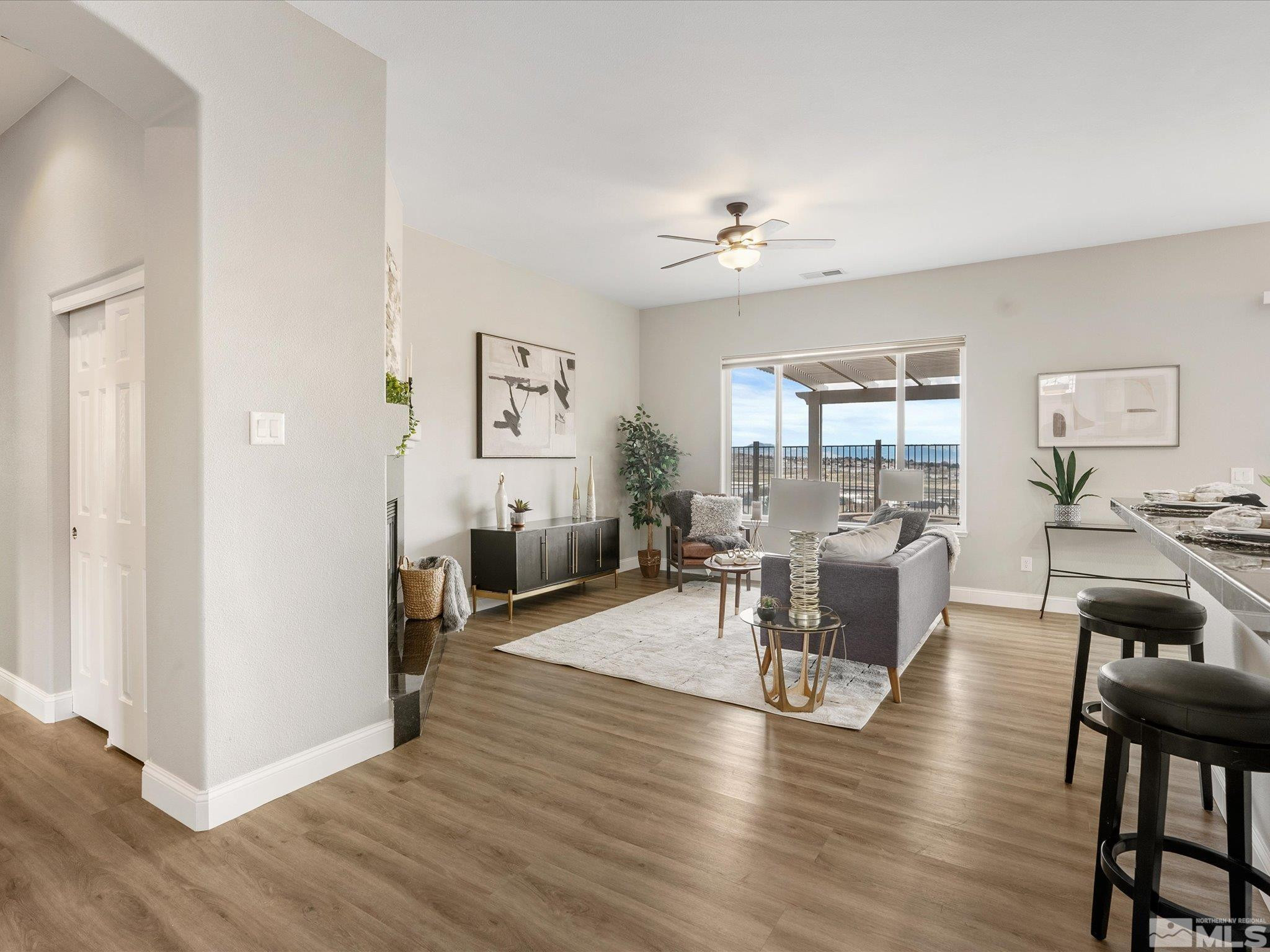 1448 Hagar Road Reno, NV 89506 - Photo 6 of 38 a living room with furniture a fireplace and wooden floor