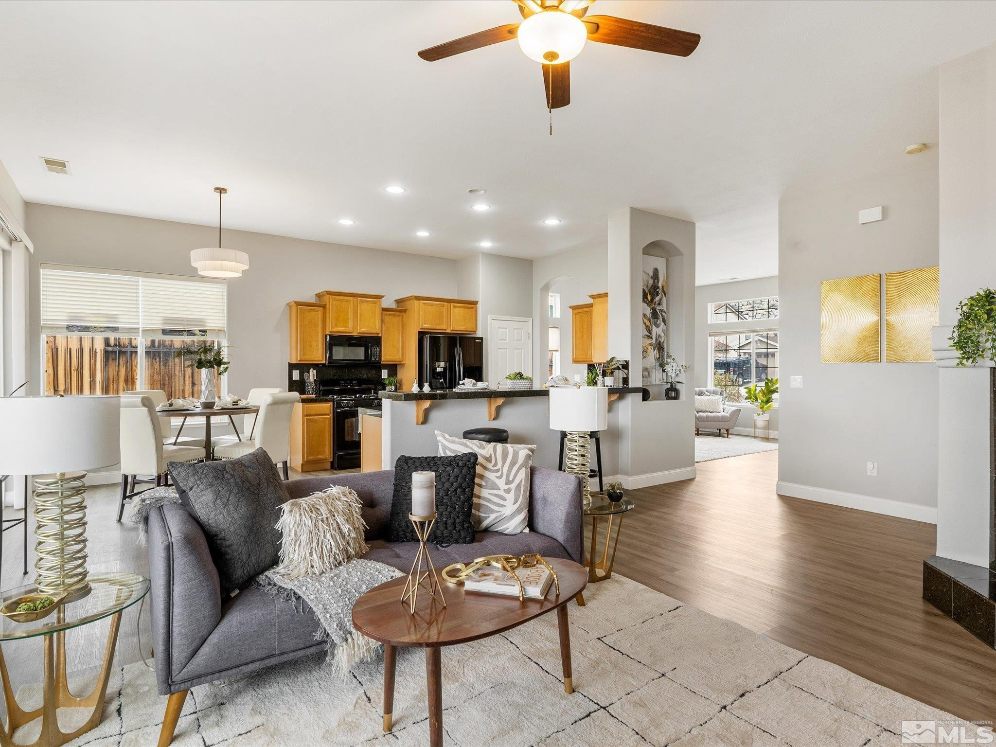 1448 Hagar Road Reno, NV 89506 - Photo 8 of 38 a living room with couches kitchen view and a view of kitchen