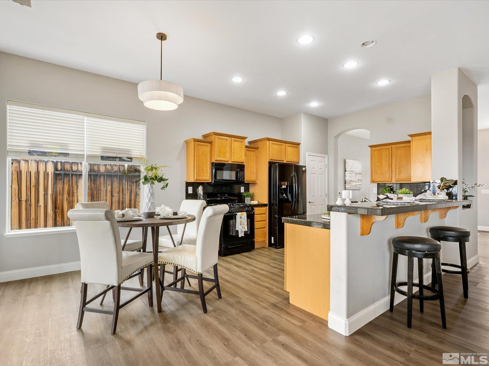 1448 Hagar Road Reno, NV 89506 - Photo 10 of 38 a view of a dining room with furniture and wooden floor