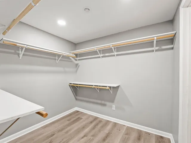 a view of an empty walk in closet