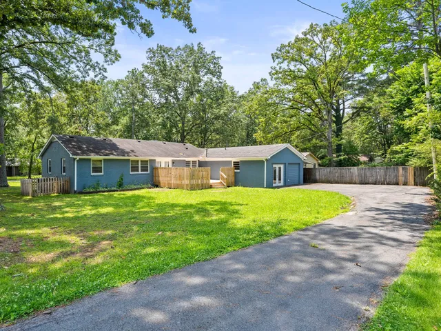 a view of a house with a back yard