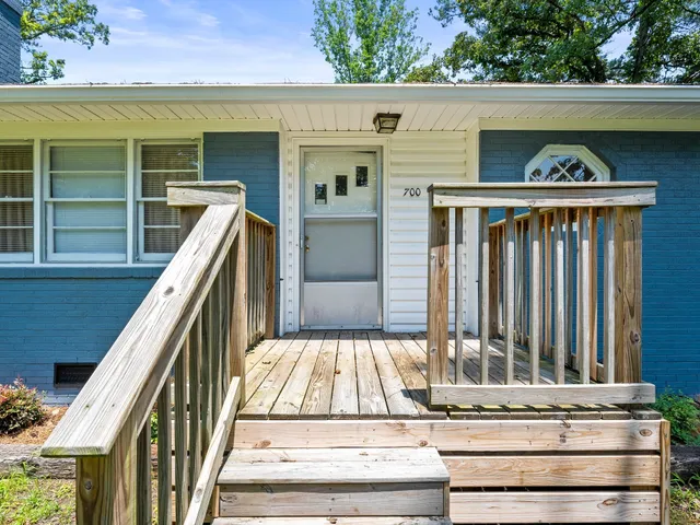 a view of swimming pool with balcony