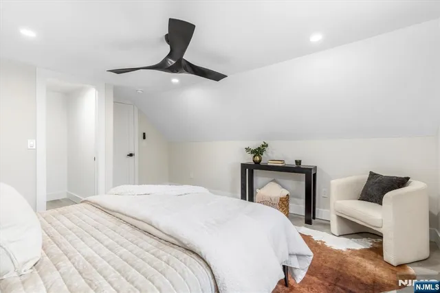 a bedroom with a bed and a couch