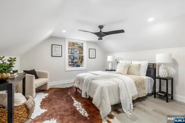 a bedroom with a bed and furniture