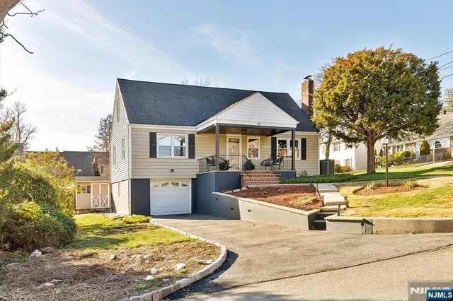 a front view of a house with swimming pool